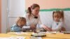 Moldova: Children and their teacher at the kindergarten in the village of Coșeni